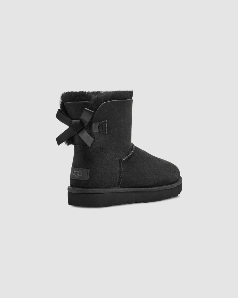 Black uggs with bows shop on the back
